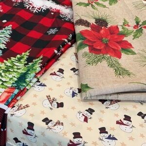 Three Christmas holiday tablecloths